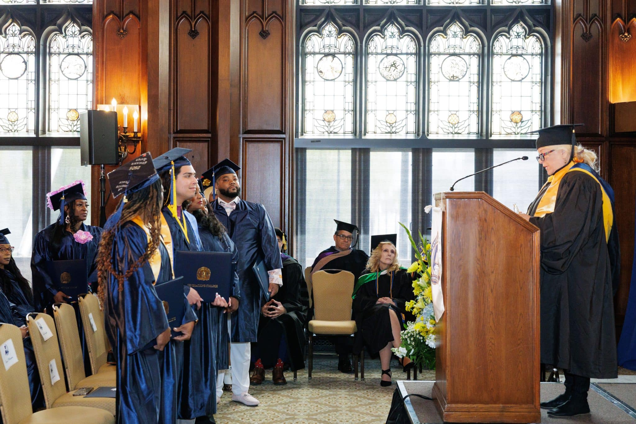 Entrepreneurial studies graduates from Generations College poses at a graduation ceremony.